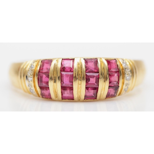 77 - A 585 gold diamond and channel set ruby ring, S, 3.5gm.