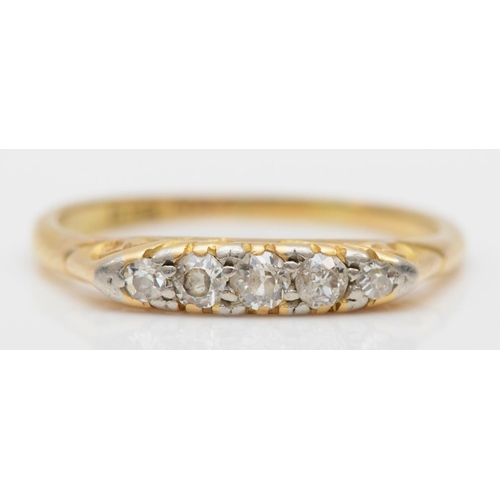 78 - A Victorian 18ct gold and platinum set graduating five stone old cut diamond ring, O, 2.4gm.