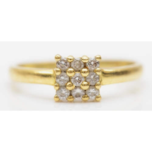 79 - An 18k gold brilliant cut diamond square set cluster ring, size O, 2.2gm.