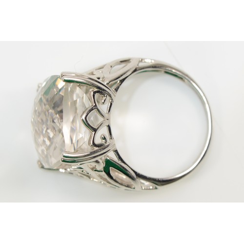 82 - A 9ct white gold rock crystal cocktail ring with pierced shoulders, M, 6gm.