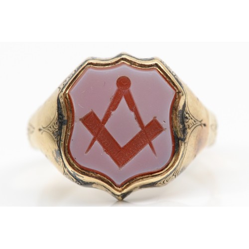 83 - Masonic interest; A Victorian gold Masonic signet ring with carved square and compass in sardonyx sh... 