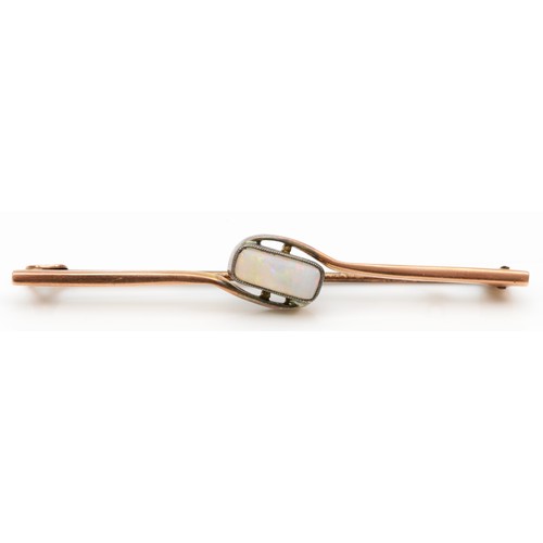 85 - An early 20th century rose gold opal bar brooch, 5.5cm, 2.8gm.