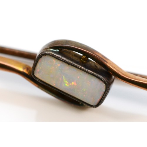 85 - An early 20th century rose gold opal bar brooch, 5.5cm, 2.8gm.