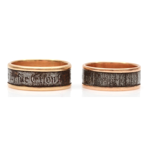 91 - Two German gold and steel wedding bands, the larger inscribed to outer band 'Gold gab ich für eisen ... 