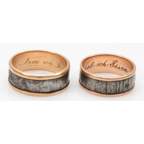 91 - Two German gold and steel wedding bands, the larger inscribed to outer band 'Gold gab ich für eisen ... 