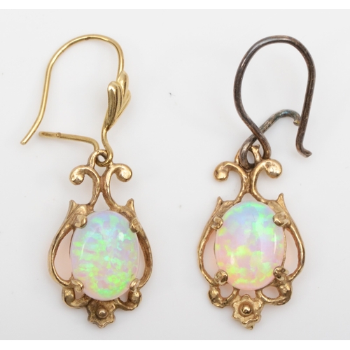 109 - A pair of unmarked gold synthetic opal drop earrings, one with replaced silver post, 17mm, 
 2.2gm.