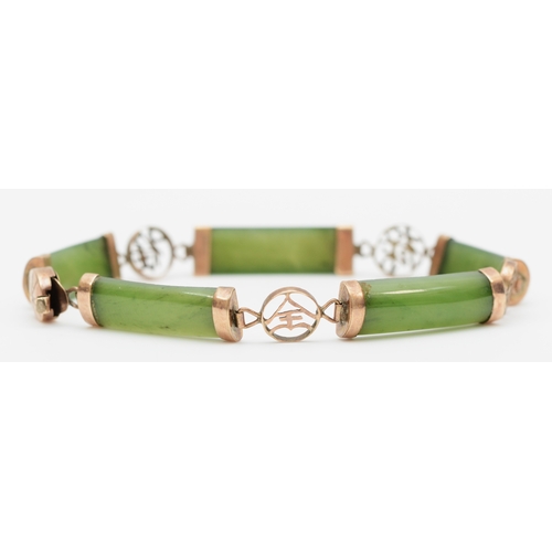 116 - A 14k gold paneled nephrite bracelet, with Chinese character spacers, 18.5cm, 8gm.