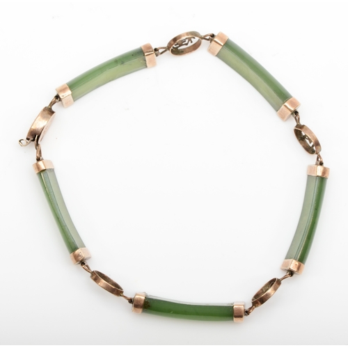 116 - A 14k gold paneled nephrite bracelet, with Chinese character spacers, 18.5cm, 8gm.