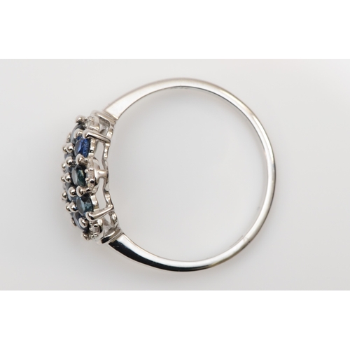 121 - A 9ct white gold sapphire and eight cut diamond cluster ring, Q, 2.6gm.