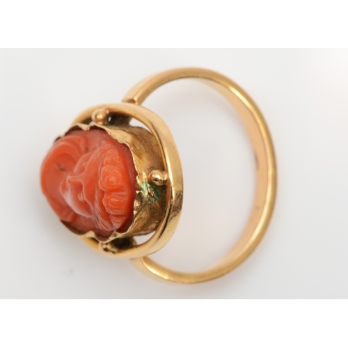 126 - A Victorian carved coral cameo ring depicting a classical maiden, 16 x 10mm, M, 5.2gm.