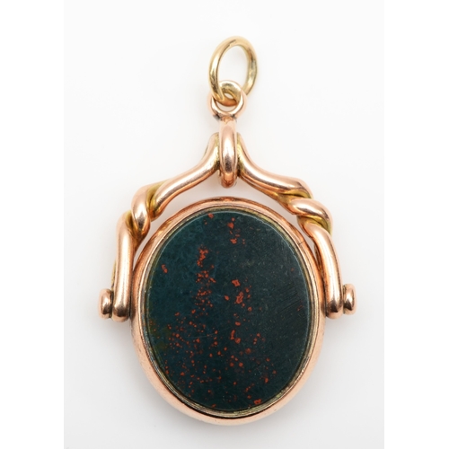 128 - A Victorian 9ct gold bloodstone and carnelian swivel fob, by Barker Brothers, Birmingham 1888,  9gm.