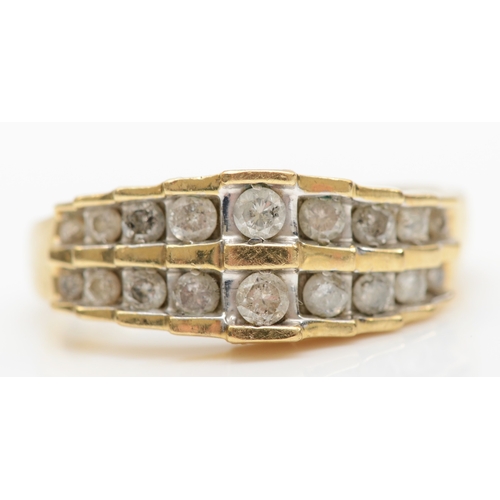 141 - A 10k gold brilliant cut diamond stepped dress ring, O, 2.8gm.