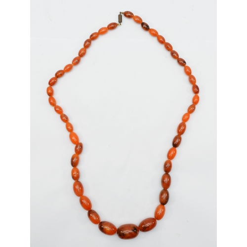 146 - A butterscotch amber Bakelite graduated beaded necklace, 14 - 29mm beads, 59gm.