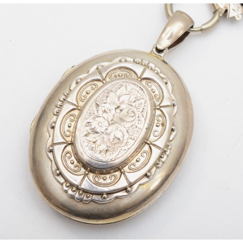 147 - A Victorian unmarked silver locket and collar necklace, the locket with chased floral and embossed d... 