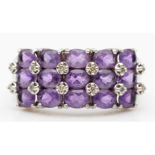 152 - A 9ct white gold amethyst and eight cut diamond cluster ring, N-O, 3.7gm.