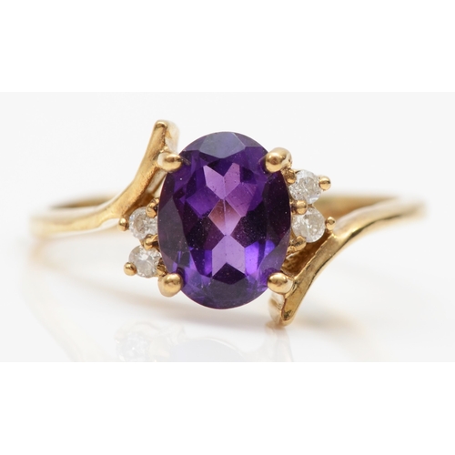 153 - A 375 gold amethyst and brilliant cut diamond dress ring, N, 3.7gm.