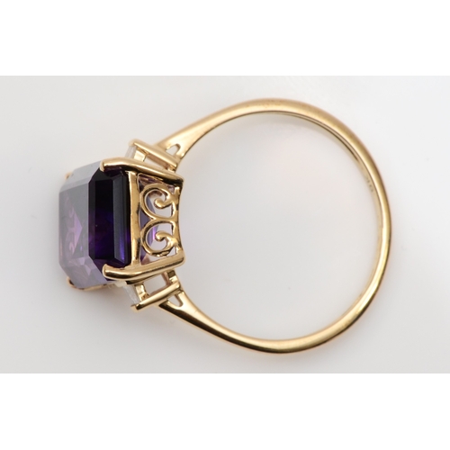 155 - A 9ct gold emerald cut amethyst cocktail ring, with baguette cut diamonds to the shoulders, R-S, 3.5... 