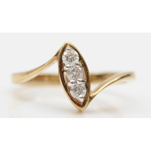 156 - A 9ct gold three stone brilliant cut diamond ring, mounted in a navette setting, O, 2.6gm.