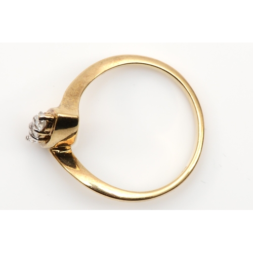 156 - A 9ct gold three stone brilliant cut diamond ring, mounted in a navette setting, O, 2.6gm.