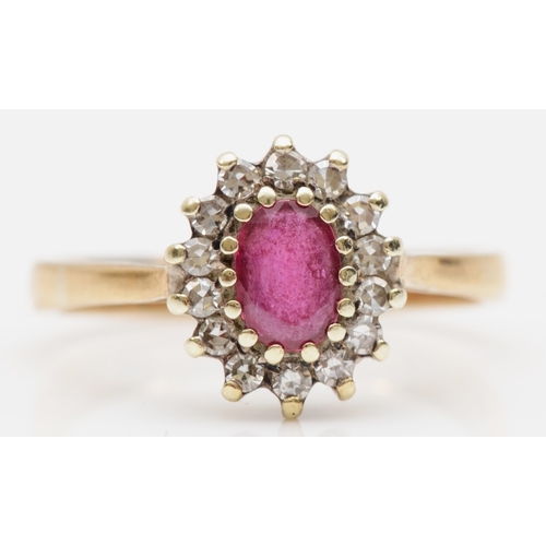 161 - An unmarked gold ruby and brilliant cut diamond cluster ring, K, 2gm.