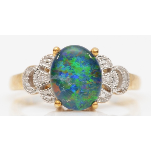 162 - A 9ct black opal triplet dress ring, with eight cut diamonds set to the shoulders, Q, 3gm.