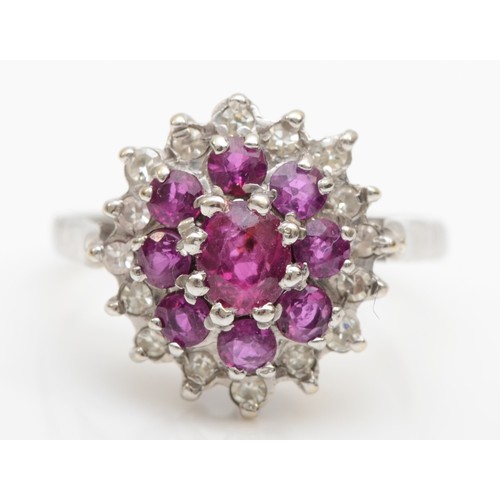 170 - An 18ct white gold ruby and eight cut diamond cluster ring, N, 4.2gm.