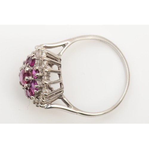 170 - An 18ct white gold ruby and eight cut diamond cluster ring, N, 4.2gm.