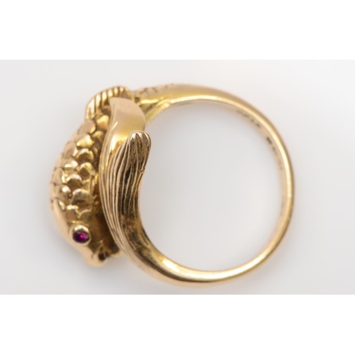 171 - A 9ct gold stylized fish ring, set with ruby eyes, L,  4.6gm.