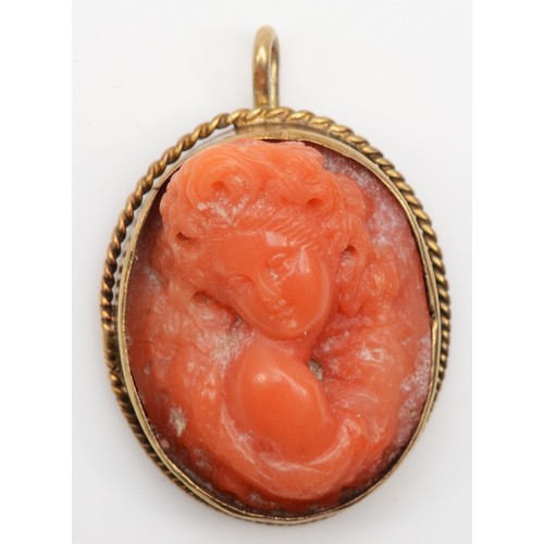 172 - A Victorian gold carved coral cameo pendant, of a classical maiden, 20 x 17mm, 4.5gm.