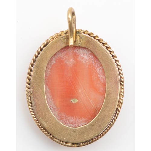 172 - A Victorian gold carved coral cameo pendant, of a classical maiden, 20 x 17mm, 4.5gm.