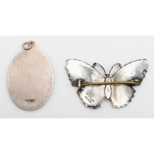 179 - A sterling silver enameled butterfly brooch, 38 x 24mm, together with a silver oval enameled pendant... 