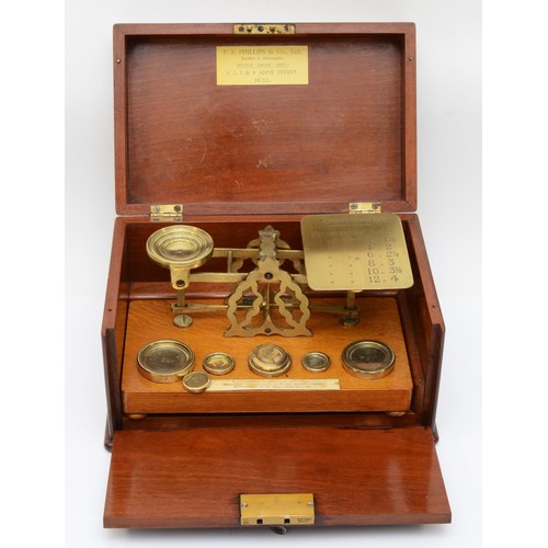 226 - A set early 20th century mahogany cased oak and brass set of postal scales, complete with brass weig... 