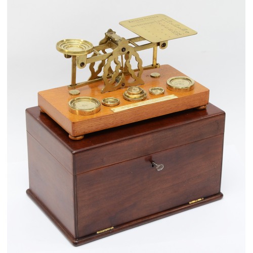 226 - A set early 20th century mahogany cased oak and brass set of postal scales, complete with brass weig... 