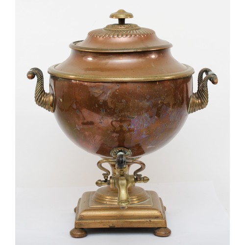 228 - A 20th century copper and brass twin handled samovar, the lid with wythern decoration, raised on ste... 