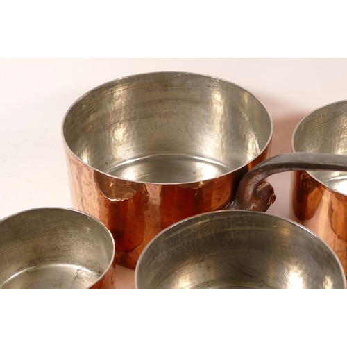 229 - A graduating set of five French copper lidded saucepans, each with iron hoop handles (5)