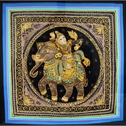 233 - A 20th century Indian stump and beadwork panel, embroidered with a Goddess riding an elephant, frame... 