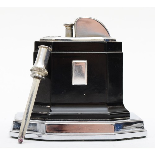 235 - An Art Deco chrome plated desk set compring of a Smiths of London 8 day desk clock, the rotating dia... 