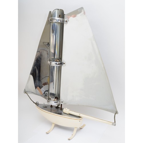 236 - A mid 20th century Yacht shaped heater (element been removed), 67x68cm.