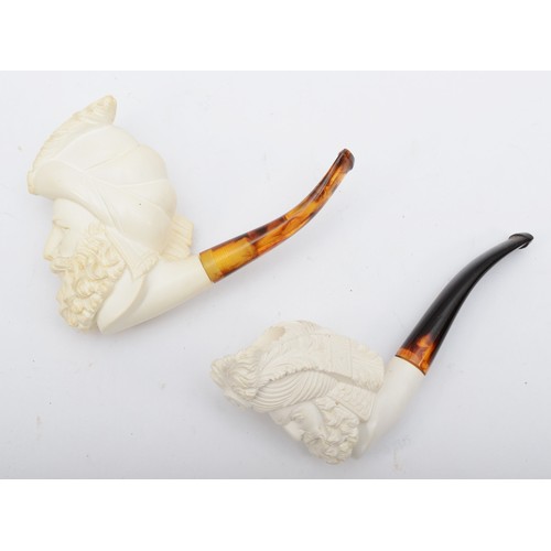 239 - Two Meerschaum style pipes, each bowl carved with the head of a bearded gentleman, 15cm long.