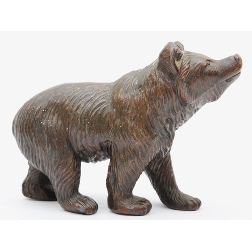 242 - 20th century bronzed spelter model of a standing bear, 18cm long.