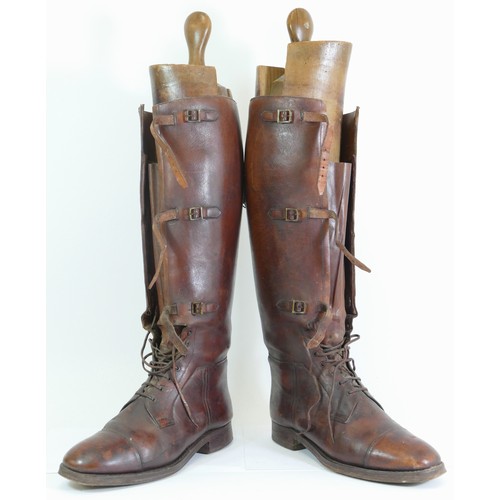 243 - A pair of 20th century brown leather riding boots, with strapwork buckles and laces, 49cm high, comp... 