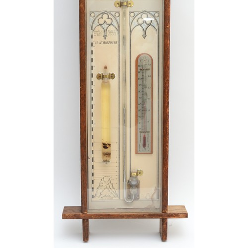 245 - A 19th/early 20th century oak cross framed Admiral Fitzroy wall hanging barometer,  with printed bac... 