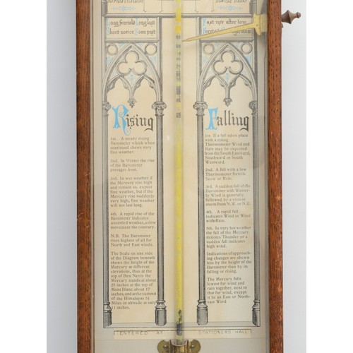 245 - A 19th/early 20th century oak cross framed Admiral Fitzroy wall hanging barometer,  with printed bac... 