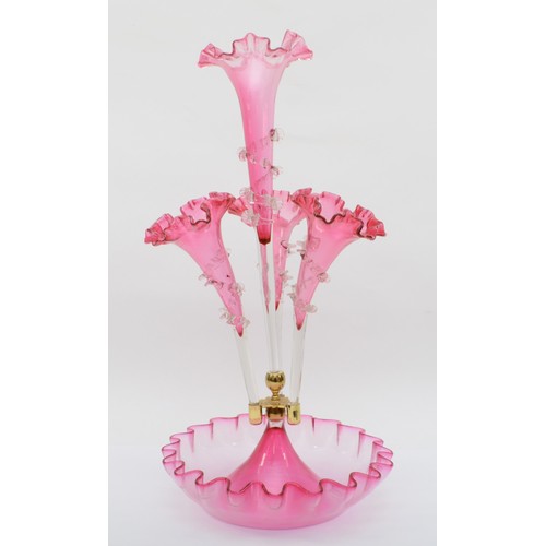 271 - A late 19th/early 20th century cranberry glass three trumpet epergne with central trumpet, standig i... 