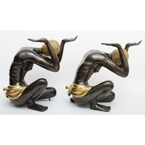 252 - A pair of cast metal blackamoor table supports, cast in the form of kneeling men a with hands up, gi... 