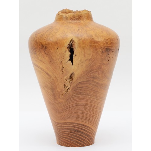 253 - Paul Boak (Contemporary), a turned walnut vase baluster shaped vase, signed to base, 20.5cm high.