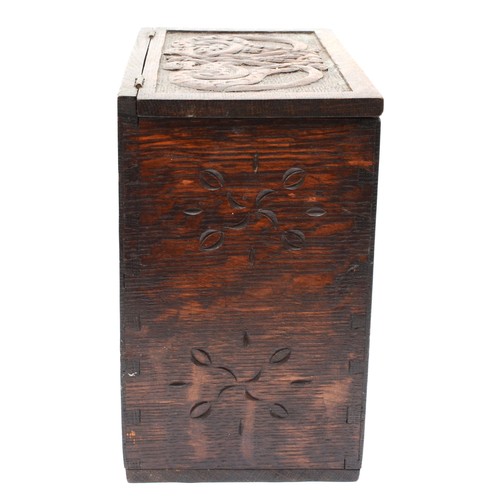 254 - A 19th century carved oak box, with hinged fall front carved with Celtic knot and pokerwork decorati... 