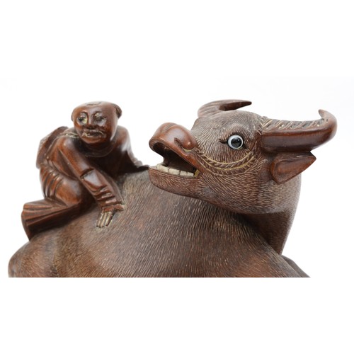 292 - A pair of 20th century Chinese carved hardwood water buffalo with boys riding their back, each with ... 