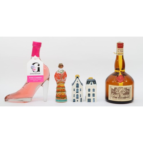 304 - Five bottles of assorted spirits comprising of two KLM porcelain 'cottage' decanters, a bottle of Gr... 