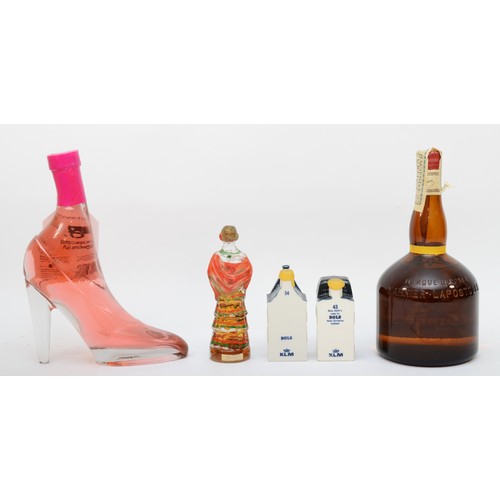 304 - Five bottles of assorted spirits comprising of two KLM porcelain 'cottage' decanters, a bottle of Gr... 